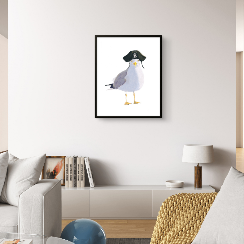 Framed artwork of a seagull wearing a hat in a living room setting.