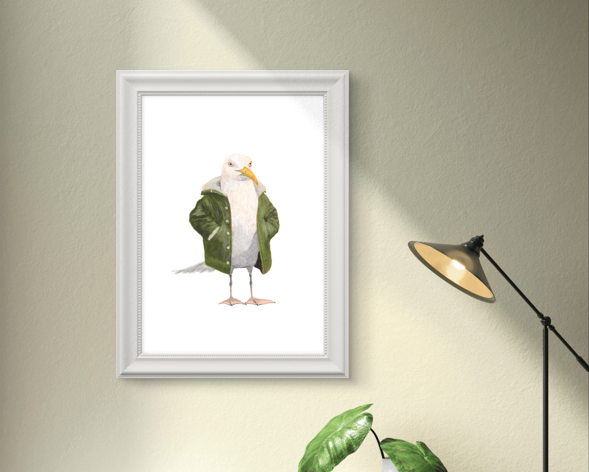 Framed wall art featuring a seagull in jacket print with a green coat and neutral background